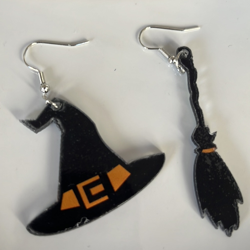 Halloween Earrings/ one witch hat and one broom. Never used.